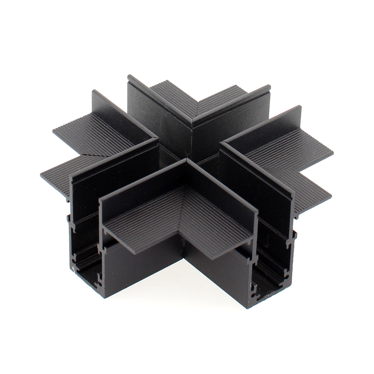 Pieza en forma de X para conectar dos tramos de carril magnético empotrado.