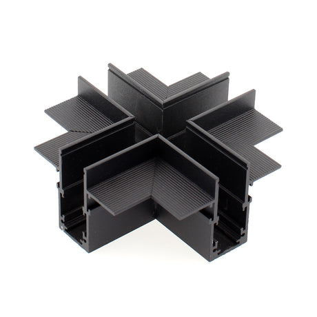 Pieza en forma de X para conectar dos tramos de carril magnético empotrado.