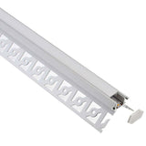Perfil fabricado en aluminio de alta calidad ideal para iluminación de cualquier ambiente (baños, cocinas, pasillos, salones, etc) Se instala en obra entre el pladur, yeso, azulejos, etc. Dispone de aletas troqueladas que facilita la inserción del cemento u otro material para asegurar así un agarre perfecto a la pared.