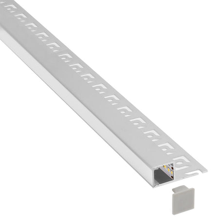 Perfil fabricado en aluminio de alta calidad ideal para iluminación de cualquier ambiente (baños, cocinas, pasillos, salones, etc) Se instala en obra entre el pladur, yeso, azulejos, etc. Dispone de aletas troqueladas que facilita la inserción del cemento u otro material para asegurar así un agarre perfecto a la pared.