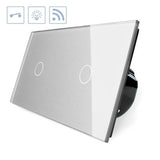 Interruptor doble de 2 cuerpos con 2 encendidos en color gris con función de control remoto (vía RF). Interruptor eléctrico de empotrar con cuerpo de aluminio y panel frontal táctil iluminado de cristal templado con acabado de alta calidad y diseño minimalista.