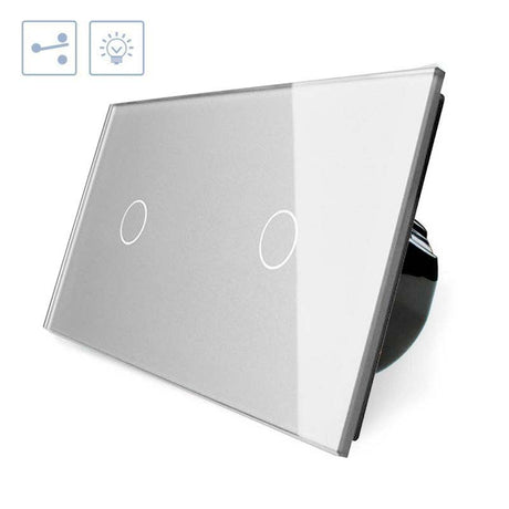 Conmutador doble de 2 cuerpos con 2 encendidos en color gris. Conmutador eléctrico de empotrar con cuerpo de aluminio y panel frontal táctil iluminado de cristal templado con acabado de alta calidad y diseño minimalista.