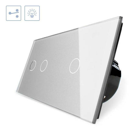 Conmutador doble de 2 cuerpos con 3 encendidos en color gris. Conmutador eléctrico de empotrar con cuerpo de aluminio y panel frontal táctil iluminado de cristal templado con acabado de alta calidad y diseño minimalista.