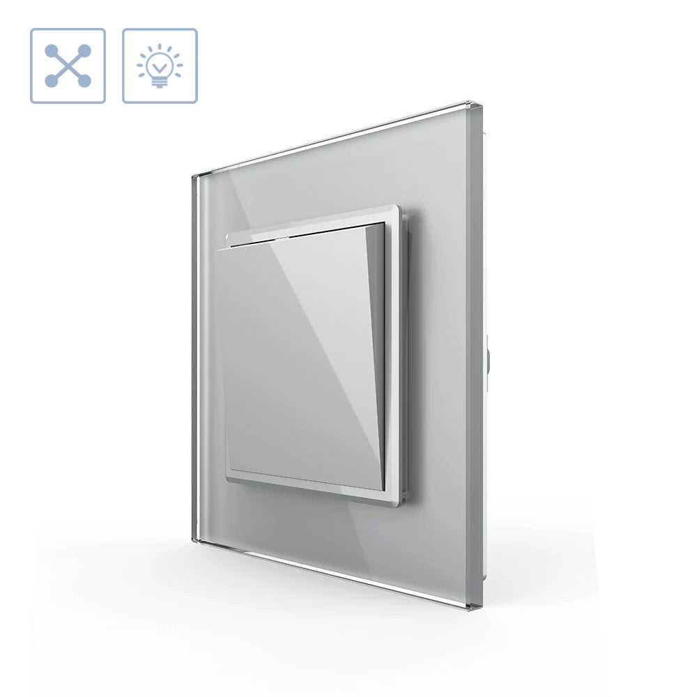 Mecanismo de empotrar EU, interruptor conmutador. Con tecla y marco de cristal de color gris. Incluye marco metálico y panel frontal de cristal. Sirve para encender y apagar la luz desde tres lugares diferentes. Por ejemplo, un pasillo, donde tienes un mecanismo en la entrada, otro en la parte media del pasillo y otro al final. Se combina con dos interruptores-conmutadores.