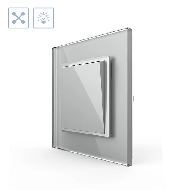 Mecanismo de empotrar EU, interruptor conmutador. Con tecla y marco de cristal de color gris. Incluye marco metálico y panel frontal de cristal. Sirve para encender y apagar la luz desde tres lugares diferentes. Por ejemplo, un pasillo, donde tienes un mecanismo en la entrada, otro en la parte media del pasillo y otro al final. Se combina con dos interruptores-conmutadores.