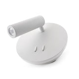 Luminaria LED realizada en aluminio de gran calidad y lacado en color blanco con iluminación de lectura y ambiental. Emite un haz de luz dirigida en cualquier dirección y un haz de luz perimetral para dar iluminación ambiental sin emisión de calor y gran eficiencia. Se puede instalar junto a la cama o sobre ella y sustituir así a una lámpara de mesa de noche. La lámpara se enciende y apaga mediante un interruptor incorporado en el soporte de pared.
